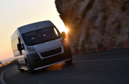 Electric Van driving in a sunrise